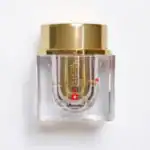 Hochwertiges Parfümfläschchen mit goldener Kappe, elegantes und luxuriöses Design für Damen und Herren.