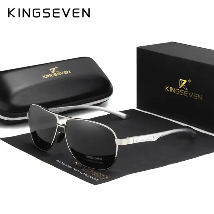 Elegante Kingsseven Sonnenbrille mit silverfarbenem Rahmen und dunklen Gläsern, inklusive schützender Aufbewahrungsbox. Perfekt für stilbewusste Fashion-Liebhaber und Sonnenschutz im Alltag.