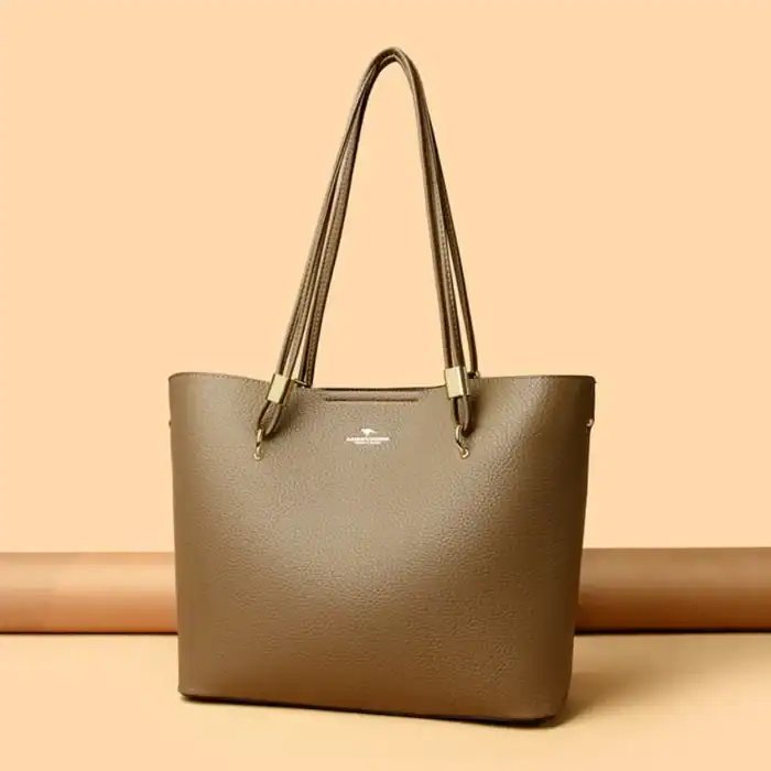 Laptoptasche aus hochwertigem Leder in neutralem Braun mit eleganten Tragegriffen, perfekt für den modernen Büroalltag.