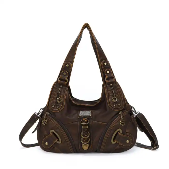 Vintagetragetasche aus braunem Leder mit vielen Zipper- und Dekorationsdetails, ideal für stilvolle Damen.